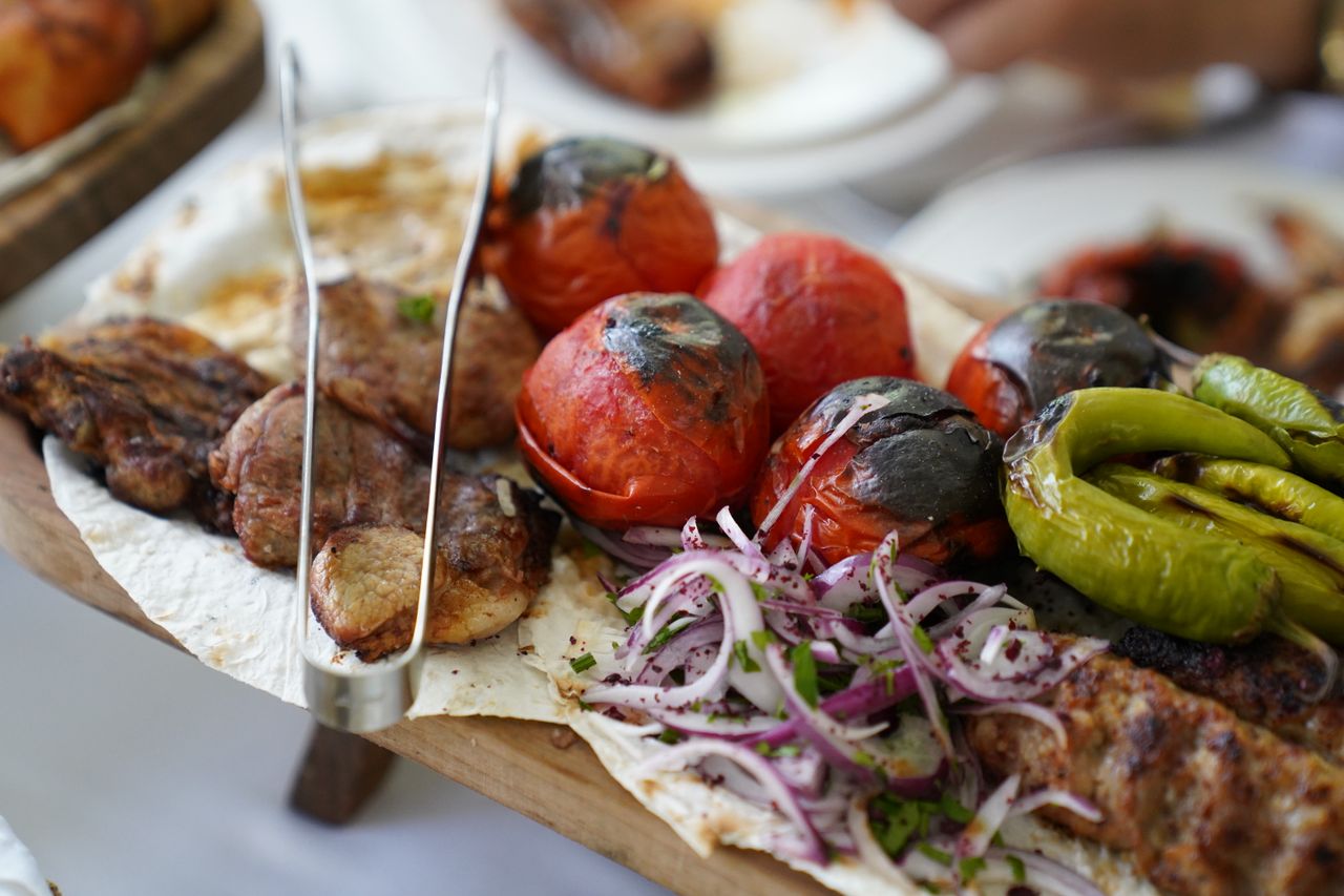 Grilled meats and vegetables served on flatbread in the hotel restaurant